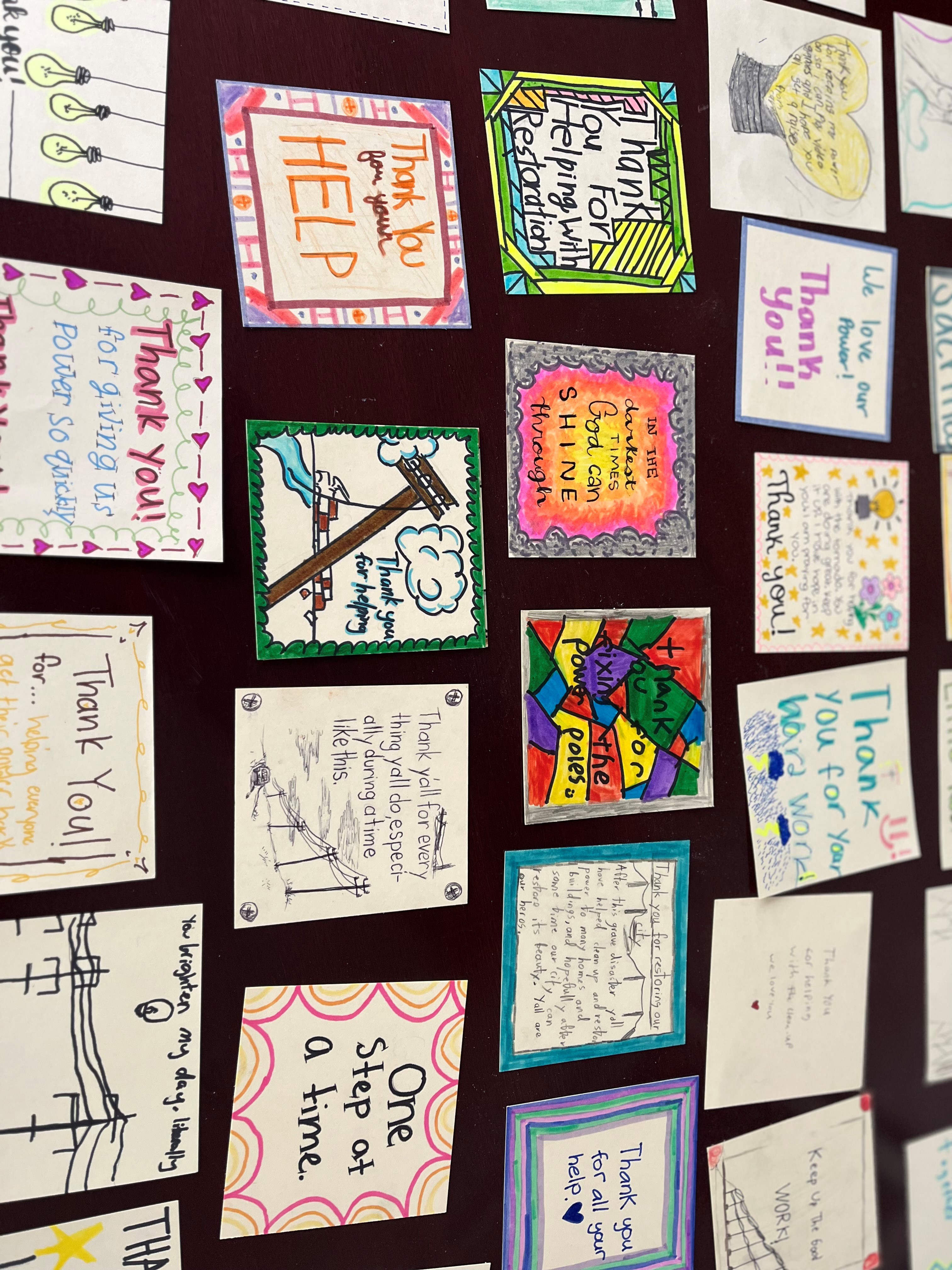 Students at Holy Souls School in Little Rock make thank you cards for line workers.